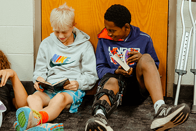 A pair of Middle School students reading.