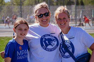 A student and members of the MPA community celebrating Homecoming. 