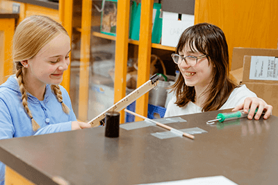 Two Middle School students working on a project. 