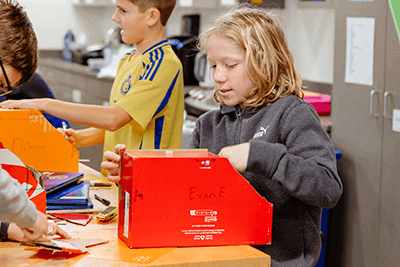 A Middle School student working on his food truck project.