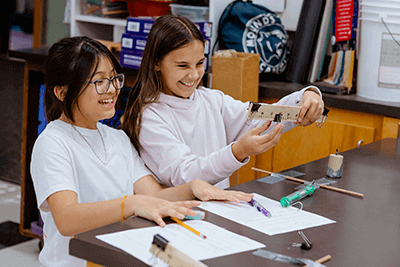 Two Middle School students working on an experiment. 