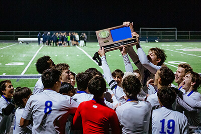 Boys soccer team celebrating win