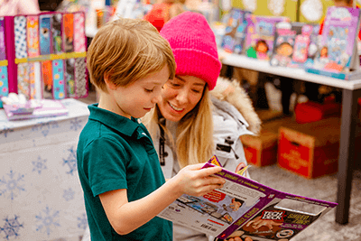 A student and parent at the MPA Book Festival. 