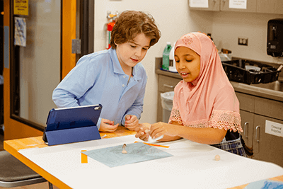 Two students working together on a film. 