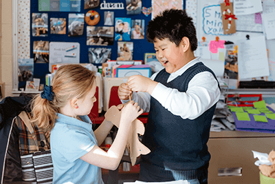 Two Lower School students working together.
