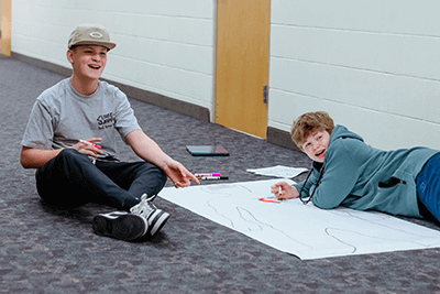 A pair of Middle School boys working on a project