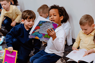Two students looking at a book