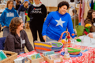 An MPA parent and her daughter laughing. 