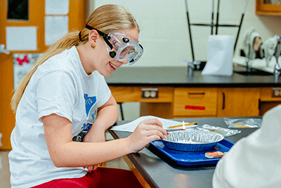 An MPA student working on a lab