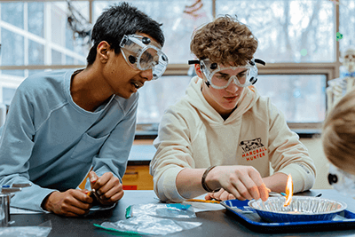A pair of MPA students working on a lab.