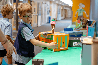 A student working with a building project.