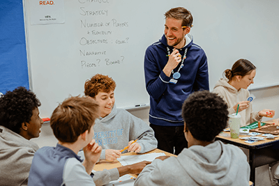 A teacher interacting with students