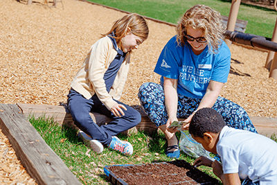 Students and a teacher working outside