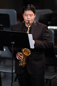 A MPA student playing the alto saxophone. 