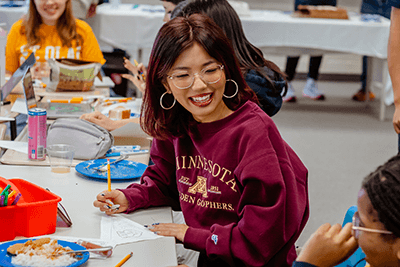 A senior smiling on college choice day. 