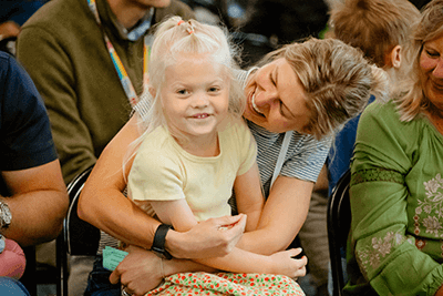 A Lower School parent and child smiling