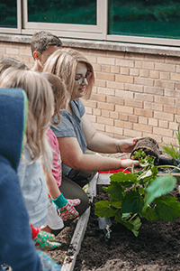 PreK working in their garden